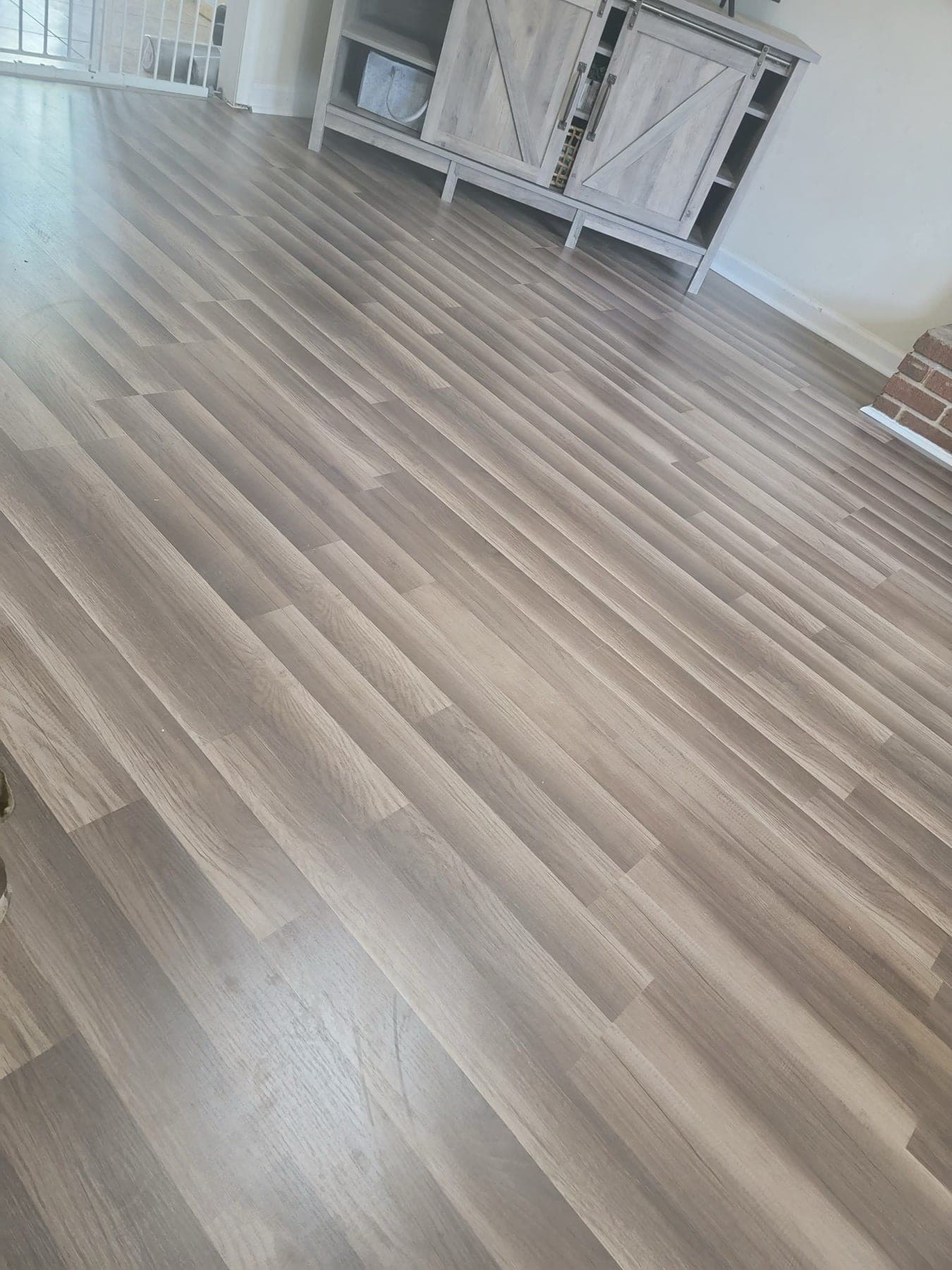 Light vinyl plank flooring in living space
