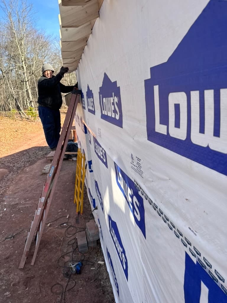 House wrap and framing in progress before siding install