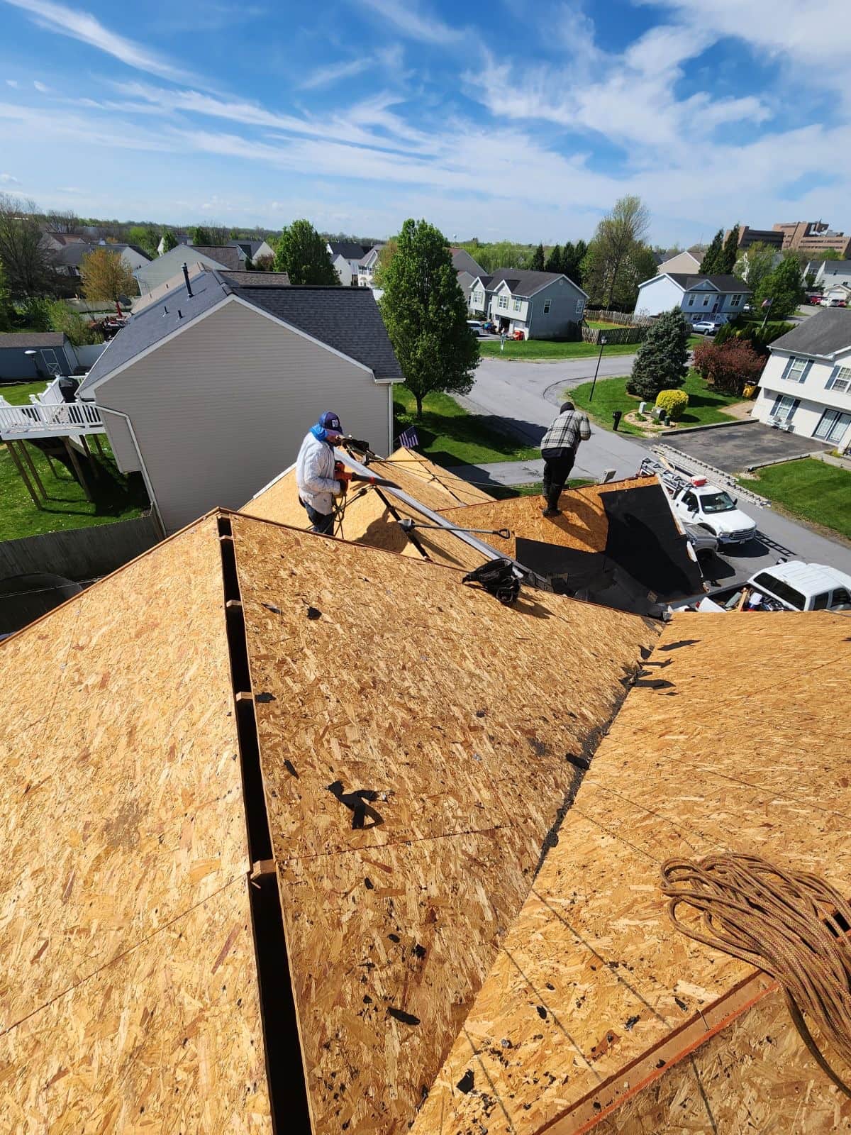Roofing crew working on a full tear-off and re-roof