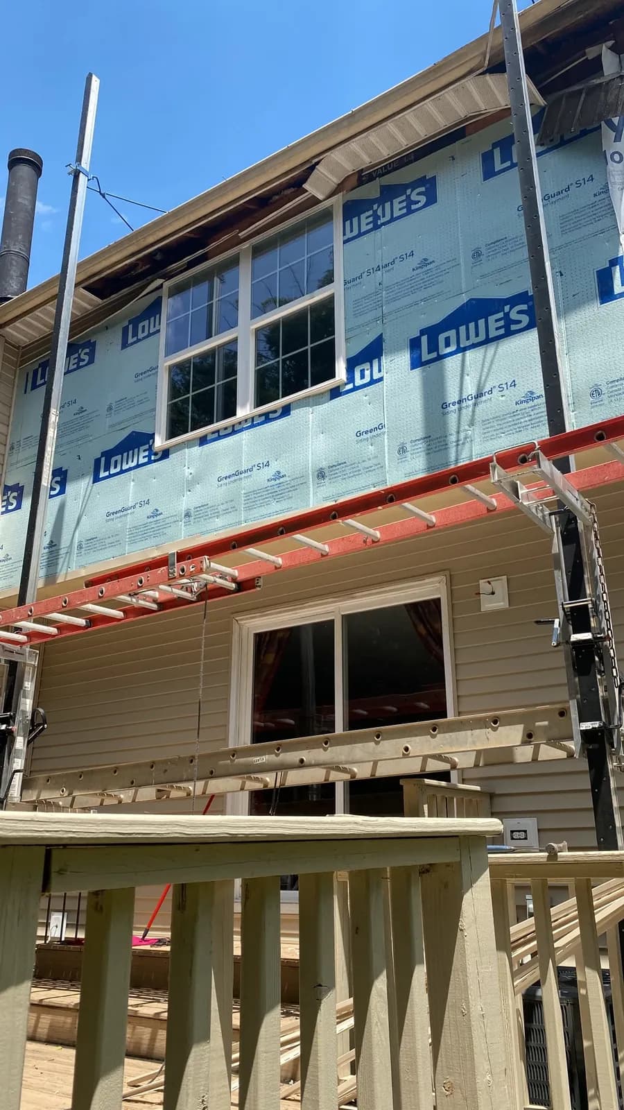 Siding and window replacement in progress