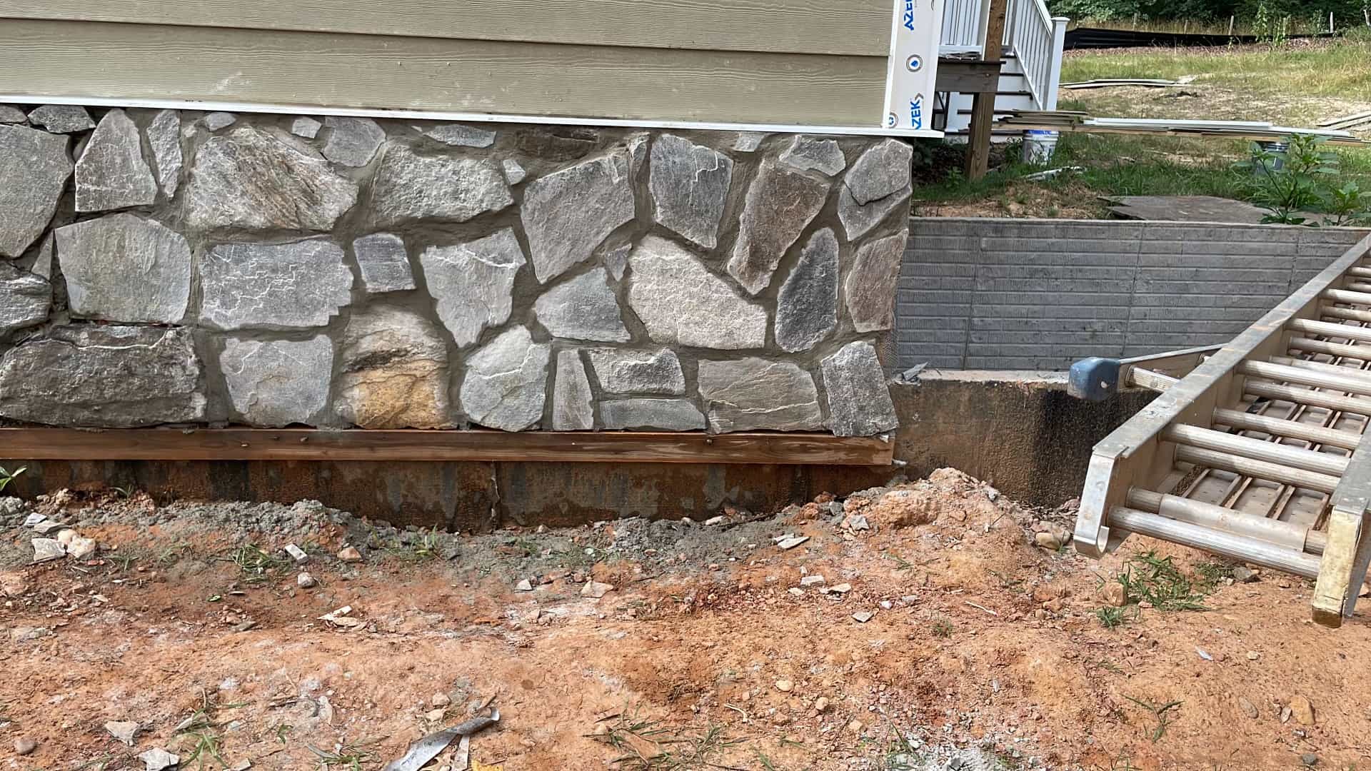 Stone veneer foundation detail on a home exterior