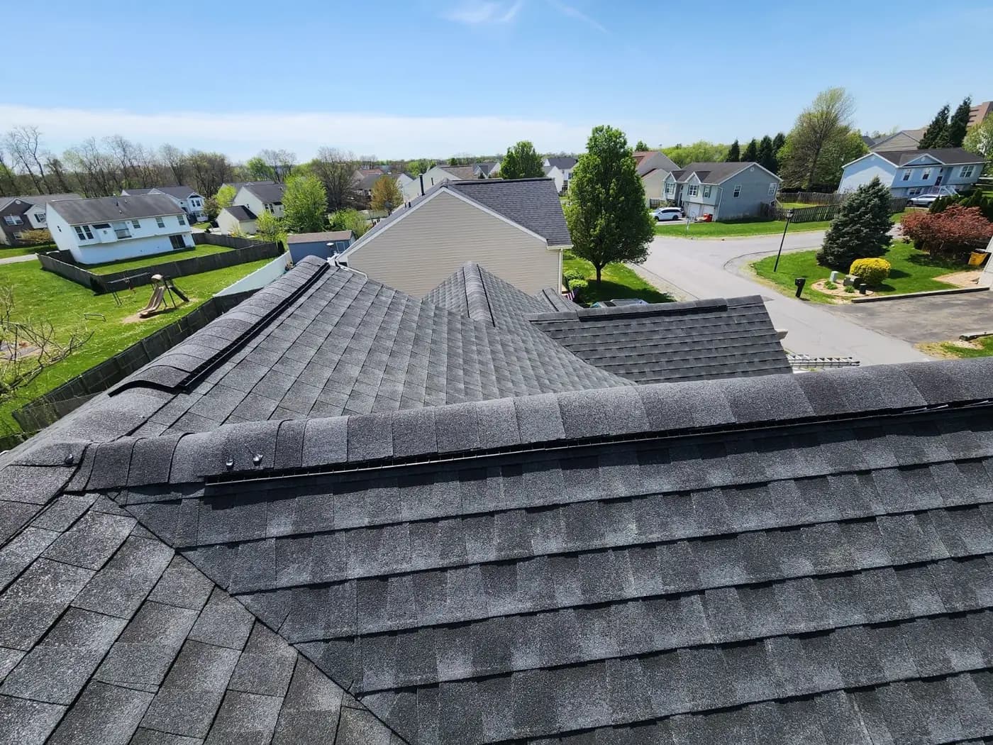 Completed architectural shingle roof seen from the ridge