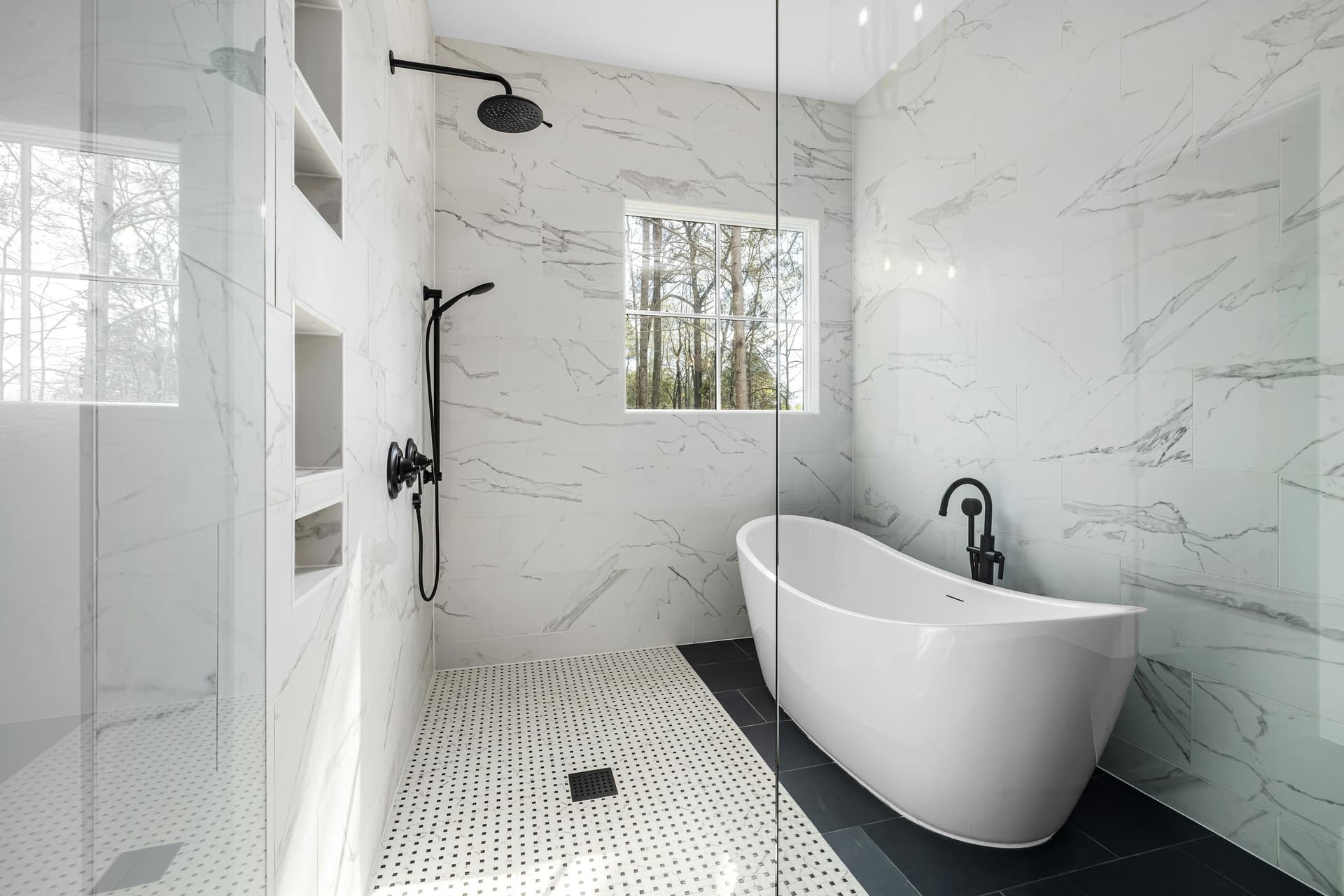Inspiration: luxury primary bath with marble tile and freestanding tub